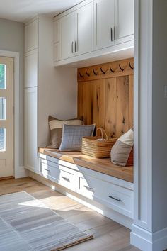 a wooden bench sitting in the middle of a room next to a door and window