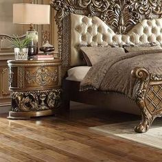 a bedroom with a bed, night stand and nightstands in gold finish wood flooring