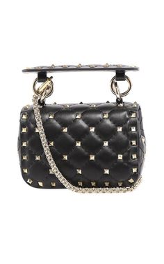 Valentino Garavani's small-yet-mighty 'Rockstud Spike' bag is a standout accessory. It's embellished with galvanized gold-tone studs and made from quilted black leather including both a thick top handle and optional chain shoulder strap. It's fitted with a cardholder inside, so you can forgo a wallet.Signature pyramid stud detailing throughout. Detachable leather carry handle with spring-ring fastening. Detachable round curb chain shoulder strap with lanyard clasp fastening. Fold over flap with Designer Formal Bags With Studs, Luxury Studded Shoulder Bag For Formal Occasions, Luxury Formal Shoulder Bag With Studs, Formal Black Shoulder Bag With Studs, Luxury Formal Bags With Studs, Luxury Studded Formal Bags, Luxury Rectangular Bags With Studs, Luxury Studded Bags For Party, Spike Bag