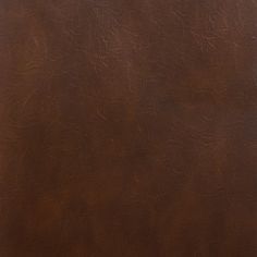 a brown leather textured background or wallpaper with some stains and scratches on it