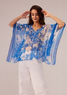 Reena Sharma | Azure Blue Kaftan Top | INDIASPOPUP.COM Chic Printed V-neck Kaftan, Chic Flowy Top For Beach Cover-up, Flowy V-neck Tops For Beach Cover-up, Blue Batwing Sleeve Blouse For Spring, Chic Printed Kaftan For Spring, Casual Summer Tops With Kimono Sleeves, Chic Tops For Beach Cover-up, Floral Print V-neck Beachwear Top, V-neck Beach Cover-up Tops