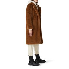 Camel brown faux fur (100% Polyester). Jacket. Long sleeves. Front hook-and-eye closure. Fully lined. Front Pockets. 25" from shoulder to hemline. Imported. Brown Long Fur Coat For Work, Chic Brown Shearling Outerwear, Brown Faux Fur Winter Outerwear, Brown Fur Coat With Faux Fur Lining For Work, Brown Long Coat With Faux Fur Lining, Brown Fur Coat With Faux Fur Trim For Winter, Chic Brown Fur Coat With Faux Fur Lining, Brown Outerwear With Faux Fur Trim For Work, Chic Brown Fur Coat With Faux Fur Trim