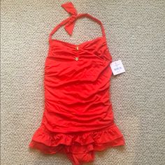 Nwt Juicy Couture Swimsuit Is A One Piece Red Suit With Slight Ruffle/Swim Skirt On Bottom. It Is A Halter Tie And Features Pretty Good Juicy Buttons. Size 14 Fitted Summer Playwear Tankini, Stretch Summer Tankini, Fitted Tankini For Playwear And Beachwear, Summer Stretch Tankini For Playwear, Red Stretch Tankini For Beachwear, Red Summer Tankini For Pool, Red Stretch Summer Tankini, Stretch One-piece Swim Skirt, Fitted One-piece Swimwear For Holiday