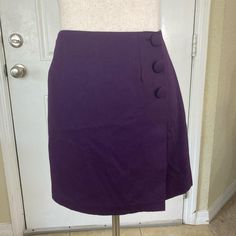 Vintage 90's purple wrap lined mini skirt, size 11. Button closure, and has nice darting  front and back. Excellent condition, no flaws. It's giving office siren vibes. Measurements laid flat: Waist: 14.5 in Hips: 17.5 in Length: 16 in