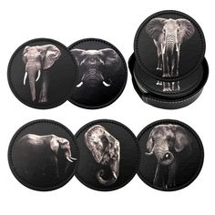 four coasters with pictures of elephants and zebras on them, all in black leather