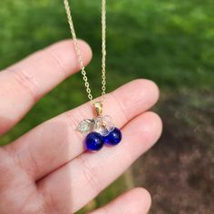 Come to make your perfect fit blueberry fruit jewelry! Discover the beauty of nature with our blueberry necklace inspired by the vibrant colors and refreshing scent of a natural blueberry. 🍇Material: You choose the design. We will handcraft with the glass blueberries, glass flowers, acrylic leaves, and 14K gold plated(hypoallergenic) chain.  🌺 Size: Can't find your perfect fit length? We offer different length options, the 16-inch, the 18-inch, 20-inch, 24-inch and 36-inch. The pendant is appr Blueberry Necklace, Acrylic Leaves, Fruit Necklace, Blueberry Fruit, Fruit Jewelry, Great Gifts For Women, Necklace Design, Cluster Necklace, Wild Berry