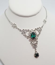 "This is a new handmade necklace. It is made with antiqued silver plated filigrees, accented with high quality EMERALD GREEN glass jewels/rhinestones that sparkle like crystals. Decorated portion is 4 1/2\" wide and 2 1/4\" tall in the center. Necklace is adjustable 15-18\" with a lobster clasp and chain extender. If you would like a different length, please send us a message. Matching earrings and headpiece are listed in our store in a variety of stone colors. If you don't see items with a colo Silver Necklaces With Historical Design For Wedding, Victorian Silver Necklace With Historical Design, Silver Jewelry With Historical Design For Wedding, Silver Historical Design Jewelry For Wedding, Silver Wedding Jewelry With Historical Design, Victorian Style Nickel-free Necklace For Weddings, Elegant Pewter Necklace In Antique Silver, Silver Jewelry With Historical Design As Gift, Elegant Pewter Necklace As A Gift