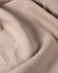 a close up view of a tan fabric textured with light brown linen, which is very soft