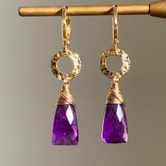 💎 Elegant, lovely yet pretty Purple Amethyst Earrings in 14K Gold Filled💎 🍀 Gemstones : Approximately 8mm x 16mm Faceted Natural Purple Amethyst 🍀 Earring size : Approximately 41 mm long  🍀 All materials are High Quality 14K Gold Filled, Nickel FREE, suitable for sensitive skin.   🍀 Healing Properties : Amethyst is a naturally powerful stone of spiritual protection and purification that clearing the mind, bring peace and getting balanced in your body and soul.  It is widely believed to be Gold Amethyst Earrings Fine Jewelry, Amethyst Dangle Earrings For Anniversary, Yellow Gold Amethyst Teardrop Earrings, Amethyst Dangle Earrings Fine Jewelry, Fine Jewelry Amethyst Dangle Earrings, Gold Amethyst Earrings With Gemstone Accents, Purple 14k Gold Dangle Jewelry, Elegant 14k Gold-filled Jewelry With Gemstone Accents, Dangle Earrings With Gemstone Accents For Anniversary