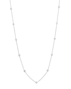 A delicate necklace in 14K white gold with diamond stations. Silver Diamond Station Necklace With Delicate Chain, Dainty White Gold Station Necklace For Anniversary, Dainty Station Necklace With Diamond Accents For Formal Events, Luxury Diamond Station Necklace With Delicate Chain, Classic White Gold Station Necklace In Sterling Silver, White Gold Station Necklace With Delicate Chain, Elegant Silver Station Necklace With Diamond Accents, Silver Diamond Cut Station Necklace For Formal Occasions, Silver Station Necklace With Diamond Cut For Formal Events