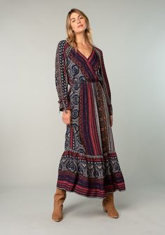 A flowy long sleeve fall bohemian maxi dress in Red & Blue floral print. Designed in LA! Shop more best-selling bohemian dresses! Red Boho Print V-neck Maxi Dress, Bohemian Maxi Dress With Surplice Neckline, Bohemian Multicolor Maxi Dress With Surplice Neckline, Red V-neck Maxi Dress With Boho Print, Patterned Paisley Print Maxi Dress With V-neck, Patterned Paisley Print V-neck Maxi Dress, Bohemian V-neck Maxi Dress With Paisley Print, Red Bohemian Maxi Dress With Paisley Print, Multicolor V-neck Maxi Dress With Paisley Print