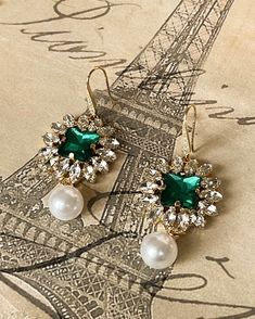 The Paris Emerald Earrings are wonderful statement earrings that will turn heads. For our Parisian Chic lady these faux emerald glass and faux pearl earrings with liven up your day. Gold plated brass and 2 inches long. Faux Pearl Earrings, Emerald Earrings, Parisian Chic, Glass Earrings, Birthstone Jewelry, Faux Pearl, Statement Earrings, Emerald, Pearl Earrings