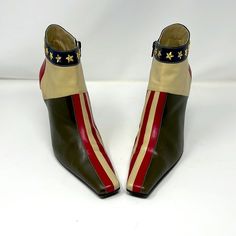 Be retro cool wearing these vintage ankle boots by Moschino. Metal stars around the top of the leather boots. Unique flag design with stripes. Olive green, ivory and red leather. Slight surface scratches and a few dings in the leather. Leather Size 38 1/2 M No Box Elongated Toe Made in Italy Powered by ExportYourStore.com 1960 Mod Fashion, Shoe Concept, Air Jordan Red, Moschino Vintage, Dirty Boots, Moschino Shoes, Vintage Moschino, Tommy Hilfiger Handbags, Pointy Shoes