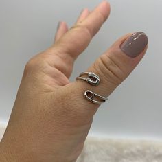 ❤️Silver Safety Pin Ring ❤️ ❤️Introducing our Silver Safety Pin Ring, a unique and stylish accessory that will elevate any outfit! This minimalist piece is perfect for those who want to make a statement with their jewelry without going overboard. The sleek design will make you feel both happy and special every time you wear it. ❤️Made with durable silver plating, this ring is specially designed to fit on the thumb and other fingers, thanks to its adjustable open ring design. You can wear it alone or stack it with other rings for a trendy look. It's a great addition to any jewelry collection and makes for a perfect Mothers Day Gift for Her. ❤️We're committed to providing excellent customer service, so we're offering free shipping and a 15-day return policy for our customers. If for any reas Safety Pin Ring, Open Ring Design, Pin Ring, Thick Ring, Bypass Ring, Wrap Rings, Open Ring, Safety Pin, Paper Clip