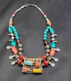 Its Beautiful Silver Necklace From Tibet With Natural Turquoise Red Coral and Carnelian and yellow copal Beads Wonderful Handmade Necklace Its Tibetan Boho Style  Material Silver  Gemstone Turquoise Coral Carnelian And Copal Length 52Cm Bohemian Turquoise Multi-stone Pendant Necklace, Unique Multicolor Beaded Turquoise Necklace, Bohemian Red Multi-stone Jewelry, Unique Multicolor Turquoise Necklace With Colorful Beads, Amulet Style Turquoise Necklace With Colorful Beads, One Of A Kind Multicolor Amulet Beaded Necklaces, Artisan Turquoise Multi-stone Necklace, Artisan Multicolor Multi-stone Turquoise Necklace, Blue Multi-stone Bohemian Turquoise Necklace