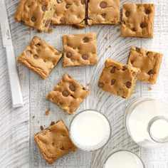 chocolate chip cookie bars and milk on a table