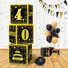 a black and gold birthday party decoration with balloons, streamers and confetti