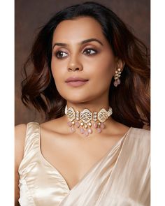 Kundan Polki Pearly Antique Choker Set - Joules By Radhika This designer handcrafted choker necklace & earring set is made with enamelled pendants etched with polkis & motifs. It has pink quartz drops & is completed with classic pearl beading.Ideal to be worn on festive, wedding & party occassions on your Indian & fusion attire. Every artistic piece from Joules by Radhika is made with real semi precious stones only, giving it a regal look & feel. Necklace has adjustable locking system to fit all Kundan Polki Choker Set, Luxury Elegant Pink Kundan Necklace, Luxury Pink Kundan Necklace For Wedding, Meenakari Chandbali Choker, Handmade Pink Bridal Necklace, Elegant Pink Meenakari Choker, Pink Cutdana Jewelry Gift, Bridal Jewellery Online, Antique Choker