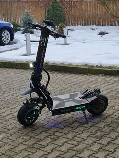 an electric scooter is parked on the sidewalk