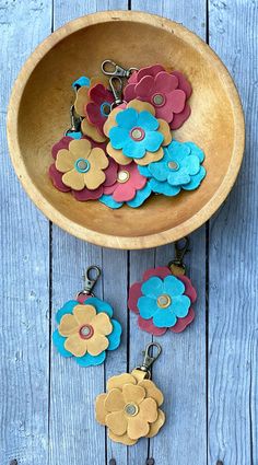 wooden bowl with flowers and keychains hanging from it