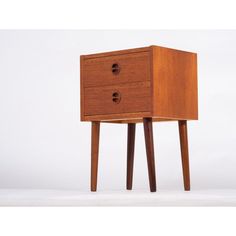 a small wooden table with two drawers on one side and an open drawer on the other