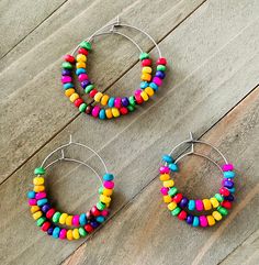 *Wooden Hoop Earrings *Stainless Steel *Rainbow Colored Beads *Available in 3 sizes These plain hoops are dressed up with vibrant colored wood. The stainless steel hoops are so light you will forget you're wearing them. They come in 3 sizes- small (25 mm), medium (30 mm), large (35 mm). They would be great to have in your wardrobe! Your hoops will be packaged neatly in a drawstring organza bag with my deepest appreciation to all customers. Wood Bead Earrings, Earrings Wooden, Diy Earring, Steel Wood, Earring Ideas, Wooden Hoop, Beaded Hoop Earrings, Beaded Hoops, Earrings Boho