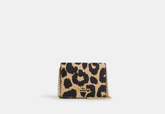 Looking for a mini wallet with major style? The Mini Wallet on a Chain in Leopard Print is here. This playful little favorite is crafted of durable coated canvas and smooth leather. Thanks to its stylish chain strap you can carry the wallet with ease and even wear it as a crossbody. It's the perfect accessory for when you want to travel light but still keep your essentials close at hand. An open outside pocket and interior credit card slots give this Mini Wallet all the functionality you need for every day. To keep your small items secure there's an easy snap closure. Pop it into your bag or carry it on its own—more than just a wallet it's a statement piece that adds a touch of personality to any outfit. Sling Bag Mini, Sustainable Bag, Woman Card, Coach Outlet, Mini Wallet, Best Bags, Coach Bag, Pop It, Travel Light