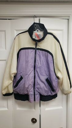 1980s Vintage Gitano Outerwear Windbreaker Nylon Large Jacket. Jacket is in very good condition. Please enlarge pictures to see condition. All clothing we sell is washed or dry cleaned. No returns. Retro Purple Windbreaker For Fall, Vintage Nylon Track Jacket For Winter, Vintage Long-sleeve Nylon Track Jacket, Vintage Long Sleeve Nylon Track Jacket, Vintage Style Long Sleeve Nylon Track Jacket, Retro Nylon Windbreaker With Pockets, Vintage Nylon Windbreaker For Streetwear, Retro Nylon Windbreaker For Fall, Retro Nylon Outerwear For Streetwear