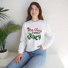 🎄 Get into the holiday spirit with our latest addition to our Etsy store! 🎉 We're excited to present a hilarious sweatshirt that's perfect for the women in your life or for yourself. If you find yourself married to the Grinch, then this is the ultimate must-have item for you.  Show off your love for Christmas while embracing your unique situation with our humorous sweatshirt. It's the ideal gift for anyone who adores the holiday season but finds themselves married to a Grinch-like character. Spread some laughter and cheer with the quote that proudly declares "Mrs. Claus, but Married to the Grinch." Don't let this opportunity slip away! Supplies are limited, and this sweatshirt is bound to be in high demand. Grab it now and make a bold fashion statement during the holiday season. It's the Ski Outfits For Women, Der Grinch, Winter Shirts, Graphic Sweaters, Men Sweatshirt, Holiday Sweatshirt, Winter Sweatshirt, Winter Mode, Holiday Sweater