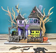 a paper house with halloween decorations on it