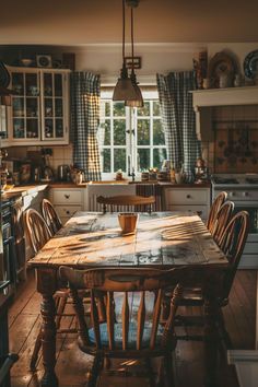 a wooden table sitting in the middle of a kitchen