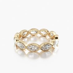 a yellow gold ring with white diamonds