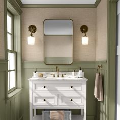 a bathroom with two sinks and a mirror