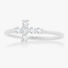 Our Little Grace Diamond Cross Ring is a twinkling token of faith. The intentional delicacy of this design makes for the heartfelt gift of a child's first piece of fine jewelry or an adult's everyday dainty wear. Metal: 18k White Gold / 18k Yellow Gold / 18k Rose Gold 6 Round Brilliant Cut Natural Diamonds: Approx. 0.24 ctw G/H Color and SI1-2 Clarity Diamonds Dainty White Brilliant Cut Stackable Rings, White Brilliant Cut Dainty Stackable Rings, Dainty White Stackable Rings With Brilliant Cut, White Sterling Silver Stackable Rings With Prong Setting, Dainty White Sterling Silver Diamond Ring, White Sterling Silver Stackable Rings With Brilliant Cut, College Rings, Mens Engagement, Diamond Cross