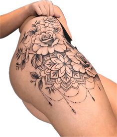 a woman's thigh with flowers on it