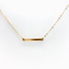 Trendy skinny bar in petite form to complete your minimalist style. Our materials make for an amazing, quality piece of jewelry, made with 14K gold filled chain and a bar. 14K gold filled chain 14K gold filled bar bar is 3 x 25 mm Bar Station Necklace, T Bar Necklace Gold, T Bar Necklace, Bar Necklace Gold, Gold Bar Necklace, 14k Gold Necklace, Chain Extenders, Gold Bar, Short Necklace