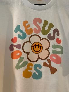 Jesus Loves You hippie/ boho tshirt. Dry blend 50% cotton 50% polyester. Multicolor Hippie T-shirt With Letter Print, Hippie Multicolor Letter Print T-shirt, White Hippie Tops With Letter Print, White Bohemian T-shirt With Letter Print, Jesus Loves You Shirt, Boho Tshirt, Boho Tshirts, Columbia Sc, Jesus Loves You