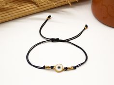 🧿 Add a touch of Greek style to your wardrobe with this minimalist Evil Eye bracelet! Made with high-quality materials, this bracelet features a small Evil Eye charm that will add a pop of color to your outfit. The Evil Eye symbol is an ancient Greek talisman that is believed to protect against negative energy, making this bracelet a perfect choice for anyone seeking both style and protection. ◼️ WHY THIS BRACELET? The adjustable length of the bracelet ensures a comfortable fit for any wrist size. This bracelet is perfect for everyday wear and can be dressed up or down depending on the occasion. It also makes a thoughtful and unique gift for friends and loved ones. ◼️ UNIQUE BONUS YOU GET WITH THIS BRACELET: A discount coupon for your next purchase and something cute inside your parcel! Minimalist Everyday Evil Eye Bracelet, Adjustable Evil Eye Bracelet For Everyday, Minimalist Adjustable Beaded Bracelets With Evil Eye, Minimalist Adjustable Evil Eye Bracelet, Minimalist Adjustable Evil Eye Bracelet As Gift, Minimalist Adjustable Evil Eye Bracelet For Everyday, Minimalist Evil Eye Bracelet For Everyday, Minimalist Evil Eye Bracelet, Minimalist Evil Eye Bracelet As Gift