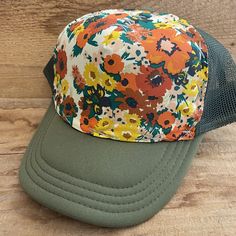 Vintage Floral Fabric bringing back the best looks.   All hats have a terry cloth lining, mesh back, and snap adjustable back. We believe in individual expression,  hand crafting, and getting outside.  Our hats are meant to instill adventure in you whenever you wear them!   Stitching is random.  If you desire a certain color (or don't want a certain color) please write in notes.  All our hats are hand stitched by us, local women,  or our team of lady stay at home mom seamstresses in L.A.  Every hat is unique as they are not mass produced.  We buy our fabrics from small fabric designers or work closely with artists or textile makers. Some fabric is custom made through working directly with artists and made in limited batches.  Customers come back again and again as our hats are comfortable, Summer Trucker Hat For Outdoor, Spring Mesh Baseball Cap, Summer Mesh Hats One Size Fits Most, Summer Mesh Hat One Size, Casual Mesh Hat For Spring, Spring Mesh Trucker Hat, Spring Mesh Trucker Hat With Curved Brim, Summer Baseball Cap, One Size Fits Most For Outdoor, Beach Mesh Trucker Hat