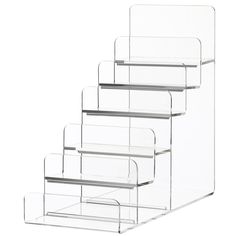 three clear acrylic shelves are stacked on top of each other