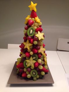 a christmas tree made out of fruits and vegetables