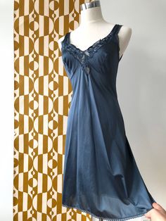 - vintage - petrol blue - negligee  - lace detail neckline - xs or small - lace trim - scoop back - super cute - empire waist, 34cm (13.5"), 38cm (15") pit to pit, 89cm (35") shoulder to hem - creases should fall out with some gentle steaming Blue Lace Sleepwear For Night, Sleeveless Blue Nightgown For Wedding Night, Blue Lace Nightgown With Lace Trim, Sleeveless Blue Nightgown With Lace Trim, Blue Lace Nightgown For Loungewear, Blue Lace Nightgown For Sleep, Elegant Sleeveless Blue Nightgown, Blue Lace Trim Dress For Loungewear, Blue Lace Trim Nightgown For Sleep