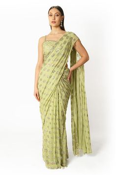 Lime green saree featuring sequin embellishment in round pattern. Paired with a sequin, cutdana and kasab embellished padded blouse. - Aza Fashions Pista Green Pre-draped Saree With Zari Work For Diwali, Green Pre-draped Saree With Mirror Work For Festivals, Green Pre-draped Saree With Resham Embroidery For Diwali, Bollywood Style Pista Green Pre-draped Saree For Festive Occasions, Fitted Green Pre-draped Saree With Mirror Work, Green Saree With Resham Embroidery For Reception, Green Pre-draped Saree With Resham Embroidery, Pre-draped Art Silk Saree With Sequins For Reception, Reception Art Silk Pre-draped Saree With Sequins