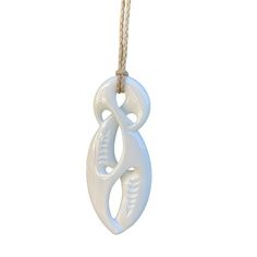 Handmade Maori Unity Twist pendant with with engraved carvings. This Twist has a modern style blending elements from the Hai-Matau and the Koru which represent prosperity, new life and peace. The Twist with its crossing design represents the many paths of life and love, as such is regarded as the original eternity symbol. A single Twist shows the joining together of two people for eternity while the double and triple twists have a similar meaning but refer more to the joining of two peoples or c White Carved Pendant Necklaces, White Carved Pendant Necklace, Artisan Carved White Necklace, White Symbolic Pendant Necklace, Traditional White Carved Necklaces, White Carved Amulet Necklace, Artisan White Engraved Necklace, Eternity Symbol, Single Twist