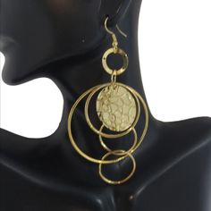 3.5" Long & 1.75" Wide Gold Drop Earrings W/ Multiple Rings And Gold Deco Discs. Fishhooks Backs W/Rubber Stoppers. Item#E1062 Fishhook Backs Rubber Stoppers Bundle & Save! Join The Live Shows! Automatically Save 25% On 3+! Buy With Confidence! 1000+ Listings Available! New Items Added Weekly! Party Cohost, Posh Ambassador & Mentor With 3000+ Sales! #Jesisfashionz #Statement #Jewelry #Fun #Fashion #Fashionjewelry #Style #Gunmetal #Statementearrings #Chunky #Funky #Diva #Largeearrings #Runway #Bo Gold Hoop Earrings In Alloy, Hoop Alloy Jewelry For Party, Party Hoop Alloy Jewelry, Gold Alloy Hoop Earrings, Gold Hoop Alloy Jewelry, Gold Hoop Jewelry Made Of Alloy, Gold Hoop Jewelry In Alloy, Elegant Circular Alloy Jewelry, Elegant Circle-shaped Alloy Jewelry