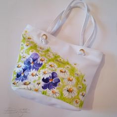 ♥Violets and Daisies Bag, Hadpainted Summer Bag, Floarl Bag, Violets Handbag, Daisies Summer Bag, Handpainted Flowers Bag, Hand Painted Bag♥ HAND PAINTED HANDBAG by DiqnaDesign. ------- SIZE & DETAILS ------- Unique handpainted product Professionally hand-painted with lots of love. Measures: 30 x 39 cm ≈ 11.8 x 15.3 inches, This bag is fastened with a zipper. There are no internal divisions. Material: Eco Leather All bags are hand painted with professional textile paint Because these are Ori White Bucket Shoulder Bag As A Gift, Artistic Tote Bags For Spring, Artistic Spring Tote Bag, Artistic Bags For Everyday Use In Spring, Handmade White Bucket Bag Gift, Handmade White Bucket Bag As A Gift, White Bucket Bag As A Gift, White Shoulder Gift Bag For Spring, Artistic White Bags For Everyday Use