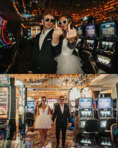 two people standing next to each other in front of slot machines and holding up their fingers