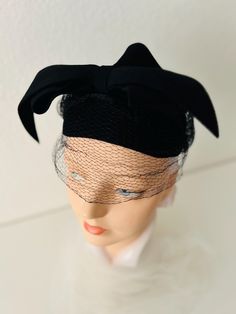 Vintage Black Wool Hat with Elegant Wool Bow and Netting Simple Felt Hat Adorable Peaked Crown Made by:   Doeskin Trademark, Size 22 Material:  wool felt, netting Label says Size 22 Crown:  5" Inside circumference:  21" Condition:  Very good vintage condition; small tear in netting in front right Classic Black Felt Cap, Fitted Black Wool Cloche Hat, Vintage Black Visor Hat, Retro Black Brimmed Mini Hat, Black Retro Brimmed Mini Hats, Retro Black Mini Hat, Black Retro Mini Hat With Short Brim, Vintage Black Wool Hats, Black Fitted Felt Hat