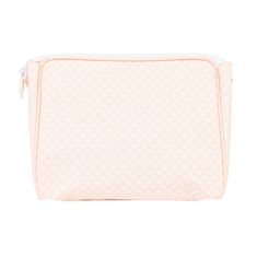 the cosmetic bag in pink and white polka dot print is shown on a white background