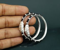 Vintage antique style handmade sterling silver gorgeous new born baby bangle bracelet kada pair for unsex kids. excellent crocodile face design customized tribal jewelry from India.Metal-925 sterling silver.Item type-Baby Bangle.Weight-11.880 grams approx.Size-3.8 cm or 1.5 inches inner diameterWidth-4 mm approx.perfect for new born baby. Makes excellent gifting and collectible jewelry. Adjustable Silver Beads Fusion Jewelry, Adjustable Fusion Style Silver Beaded Jewelry, Adjustable Stackable White Gold Bangle, Black Spiritual Bangle Jewelry, Spiritual Black Bangle Jewelry, Fusion Style Stackable Round Jewelry, Traditional Black Hallmarked Jewelry, Stackable White Gold Bangle As A Gift, White Gold Stackable Bangle Jewelry